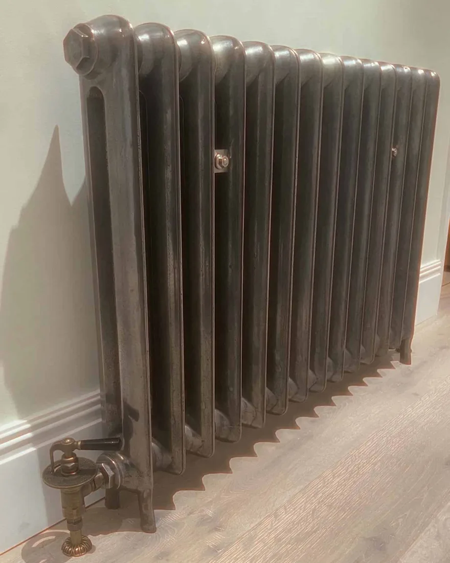 Restored period column radiator installed as part of a bathroom renovation